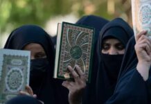 Denmark contemplates baning Quran-burning protests Women holding Qurans in their hands are demonstrating against the burning of Qurans in Sweden and Denmark