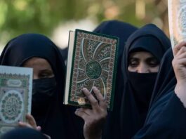 Women holding Qurans in their hands are demonstrating against the burning of Qurans in Sweden and Denmark
