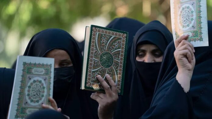 Women holding Qurans in their hands are demonstrating against the burning of Qurans in Sweden and Denmark