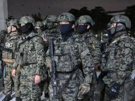 Military forces move outside the National Assembly, after South Korean President Yoon Suk Yeol declared martial law, in Seoul, South Korea,